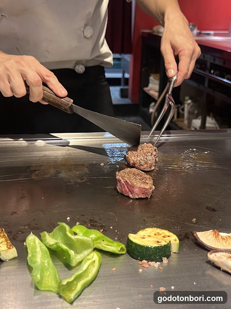 Chef Grilling Steak on Teppan