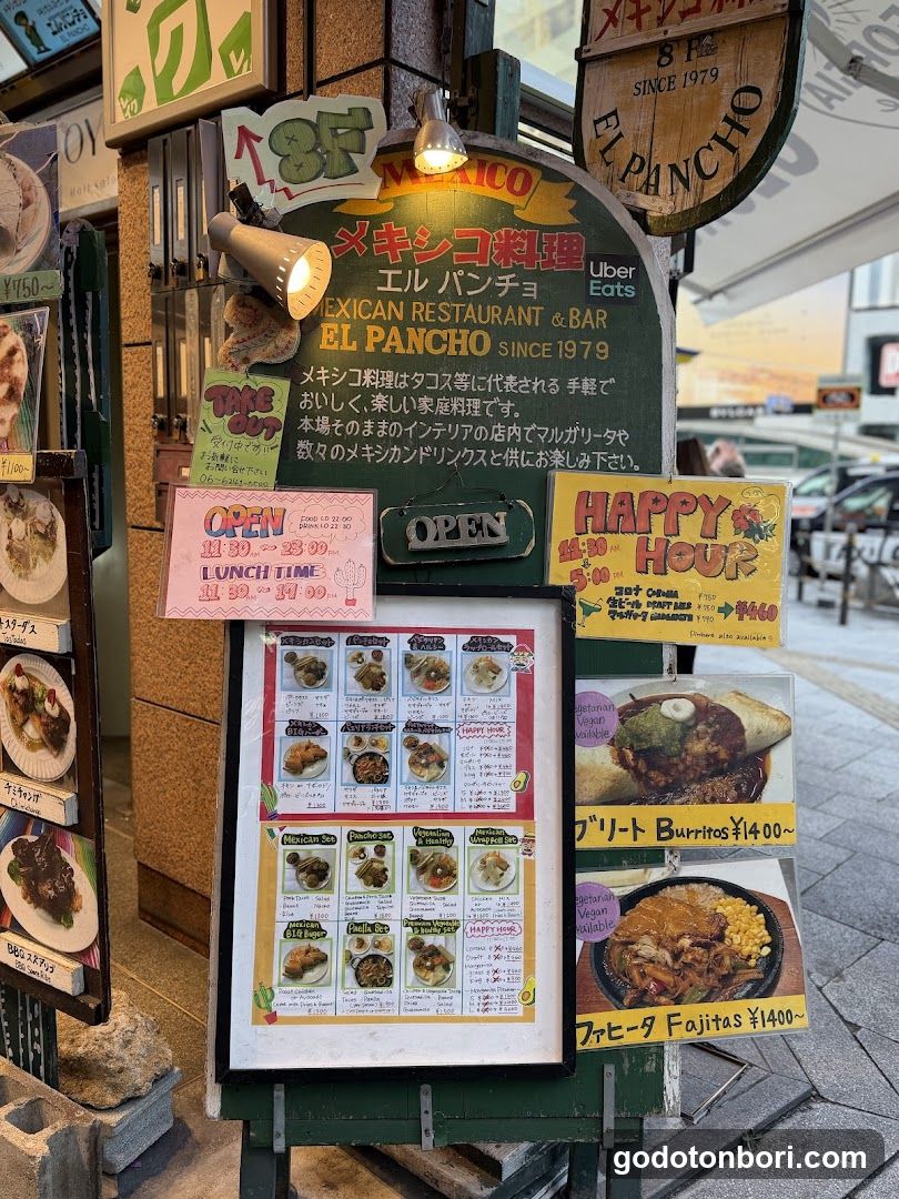 Exterior of El Pancho, a Mexican restaurant and bar since 1979. Visible signage includes '8F', 'Uber Eats' logo, and 'Happy Hour' promotions. Menu boards display burritos and fajitas with prices.