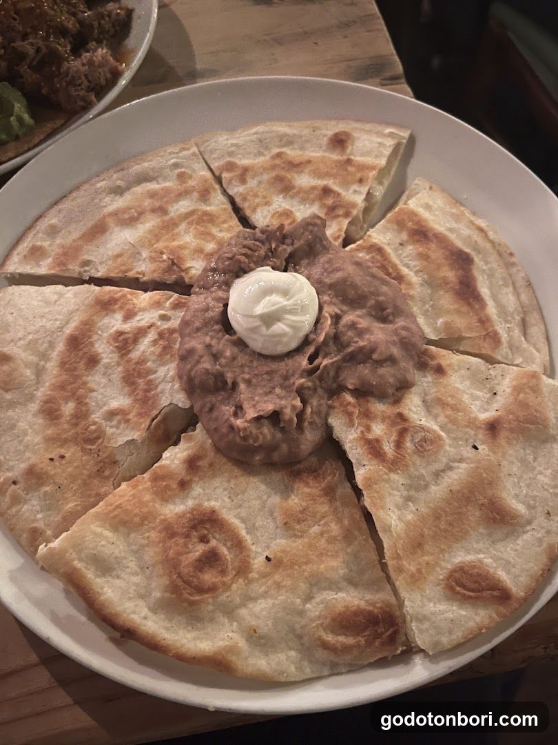 Quesadilla with Refried Beans and Sour Cream