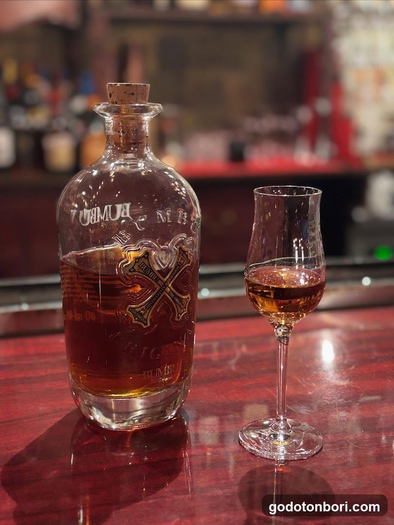 Bottle of Rum and Glass on Bar Counter