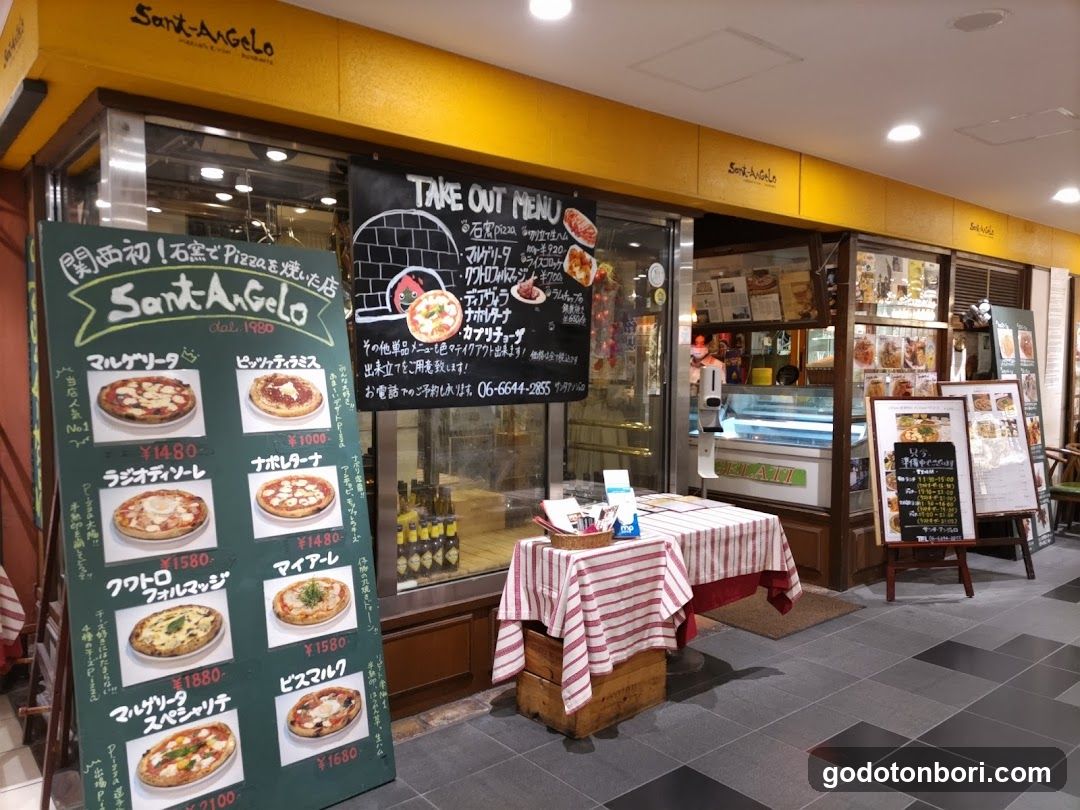 Pizza Shop Exterior with Menu Boards