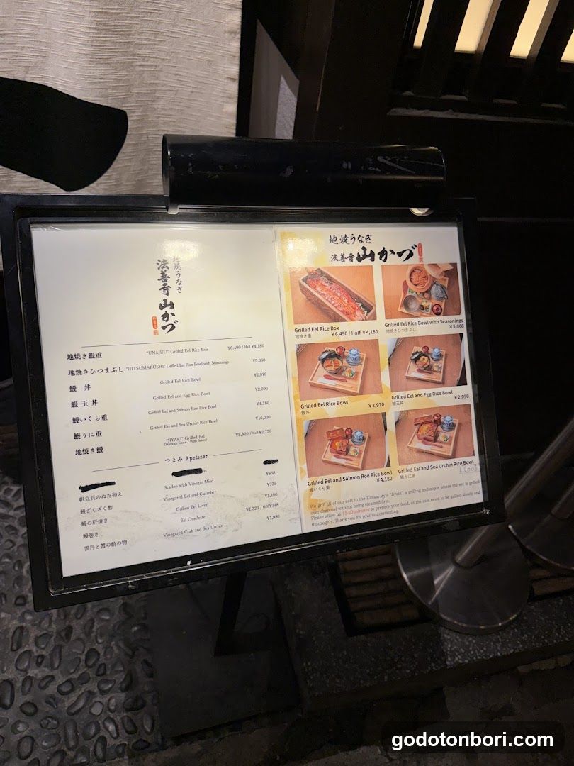 A menu board displaying various grilled eel dishes with prices and images.