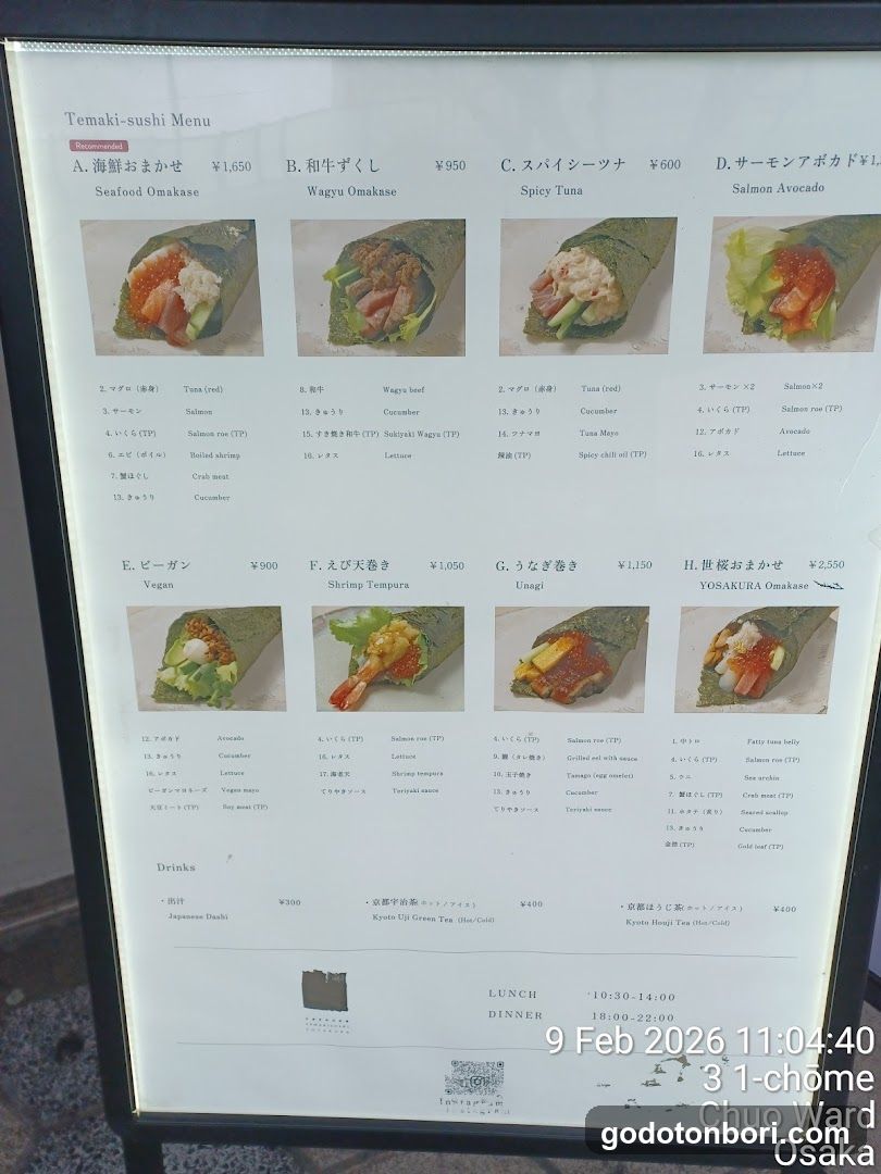 A menu board displaying various sushi rolls with prices and descriptions in Japanese and English.