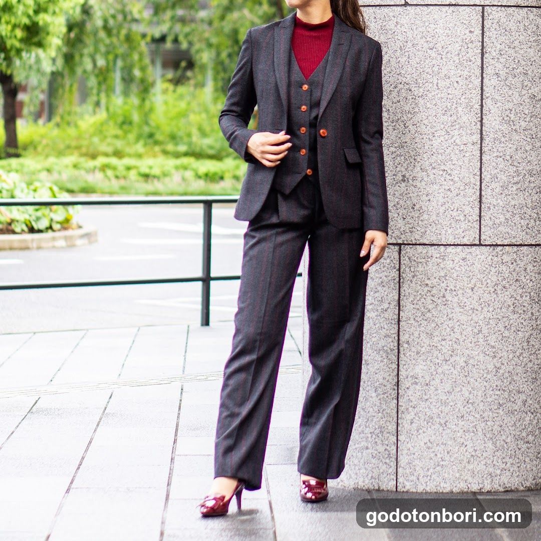 Woman in Suit Standing Outside Building