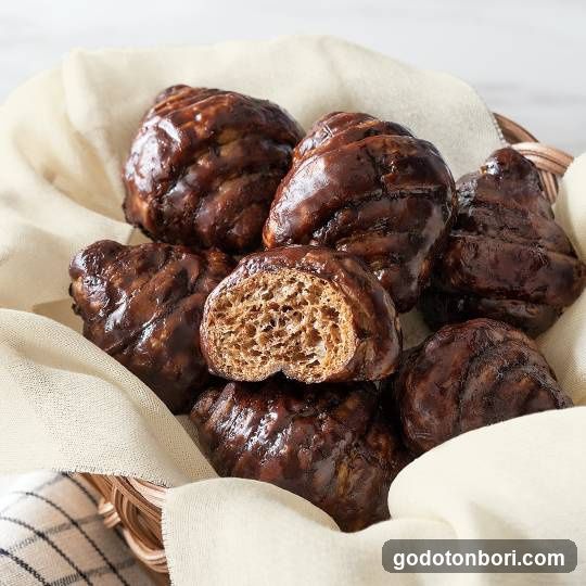Glossy Chocolate Buns in Basket