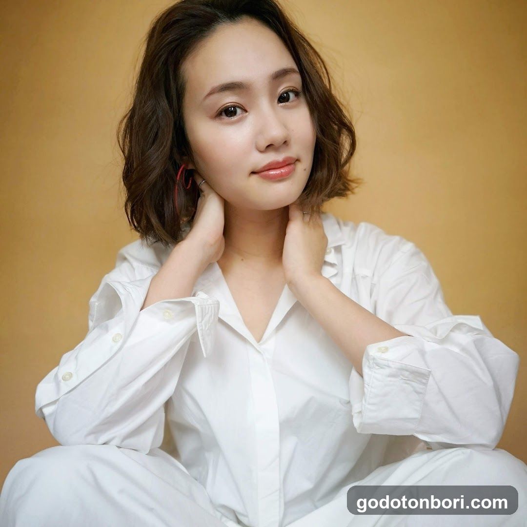 Portrait of a woman in white shirt