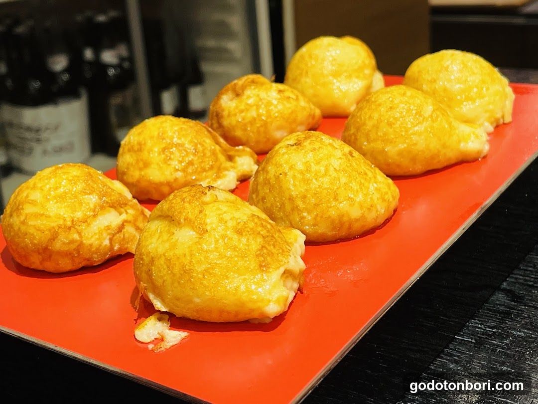 Golden Fried Dumplings on Red Plate