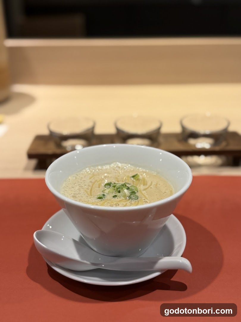 Bowl of creamy soup with green onions