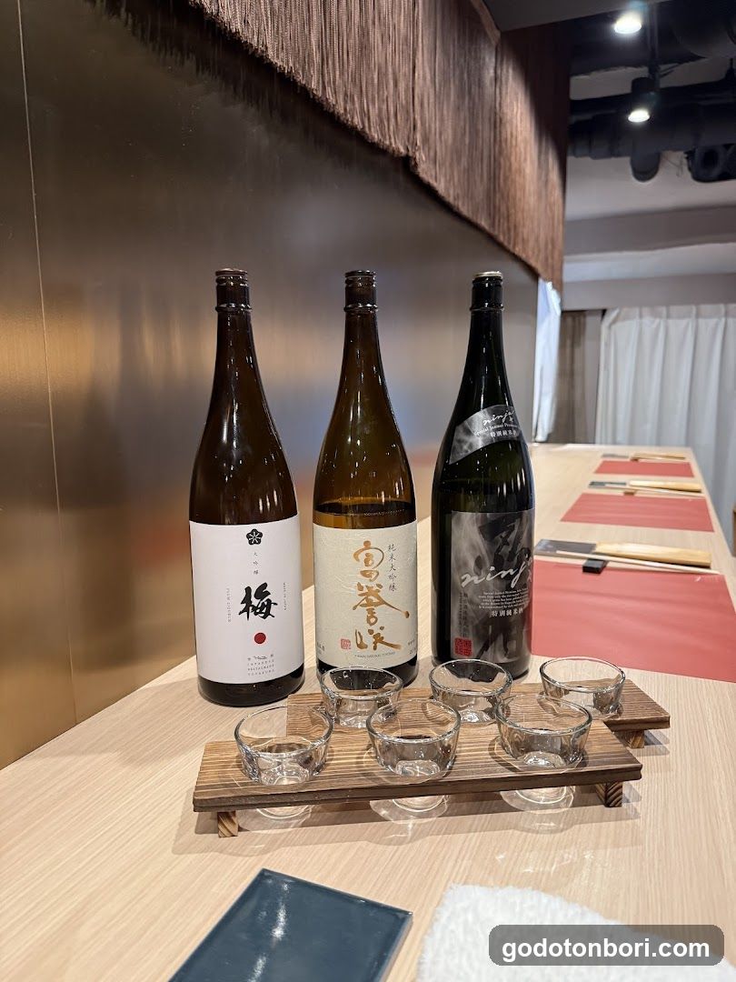 Sake bottles and tasting glasses on a table
