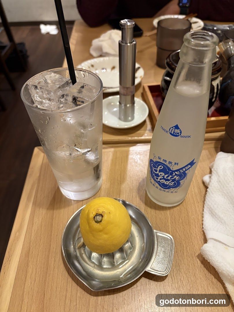 Lemon Soda and Ice Water at Restaurant Table