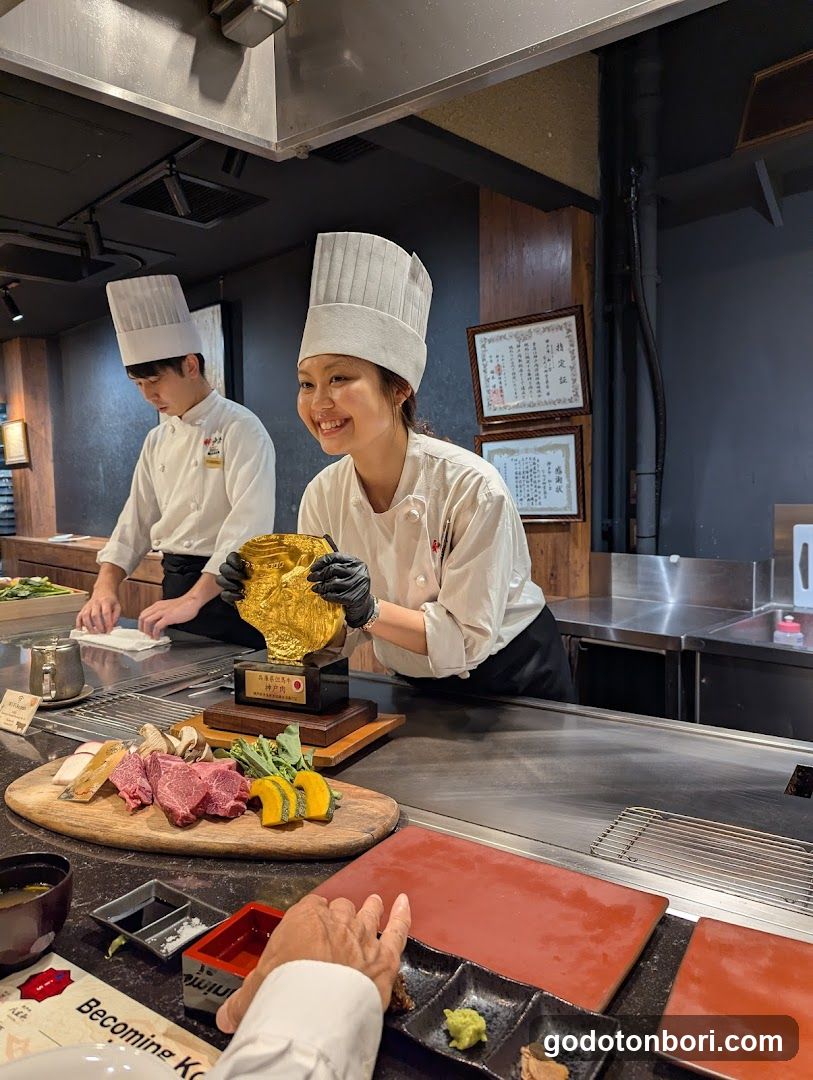 Chef Holding Golden Platter at Omakase Restaurant