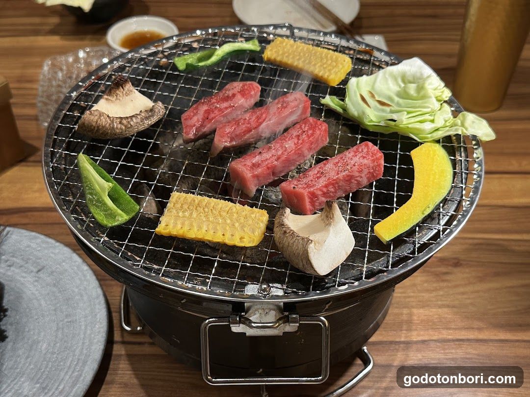 Grilled Meat and Vegetables on a Portable Grill