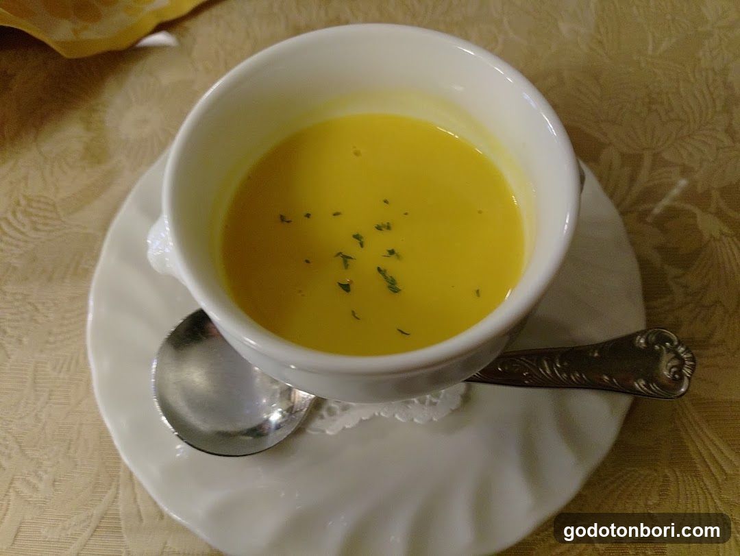 Yellow Soup in White Bowl