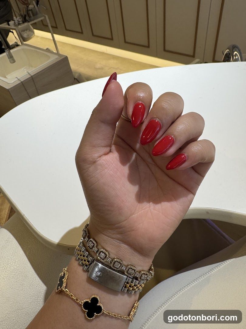 Red Manicure and Jewelry Display