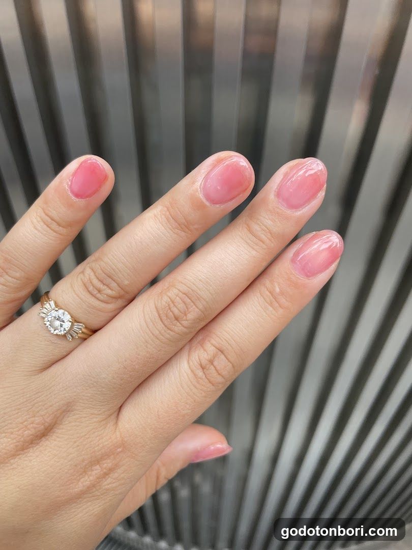 Hand with Pink Nail Polish and Ring