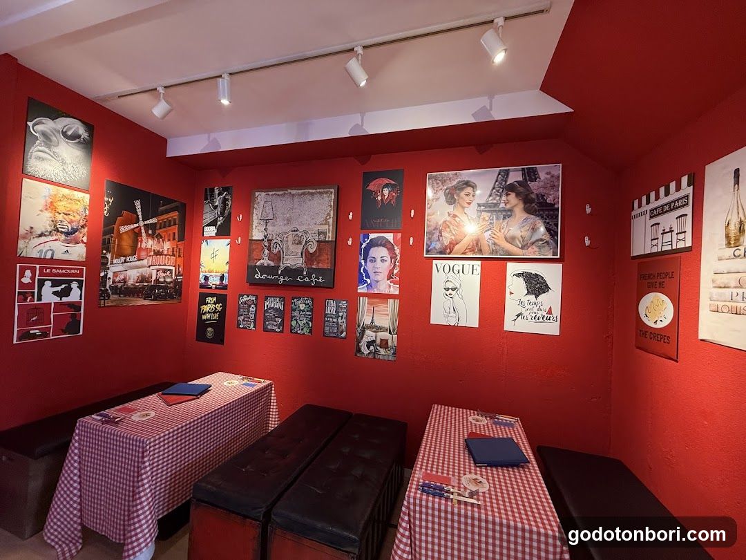 Red-themed interior with posters and tables