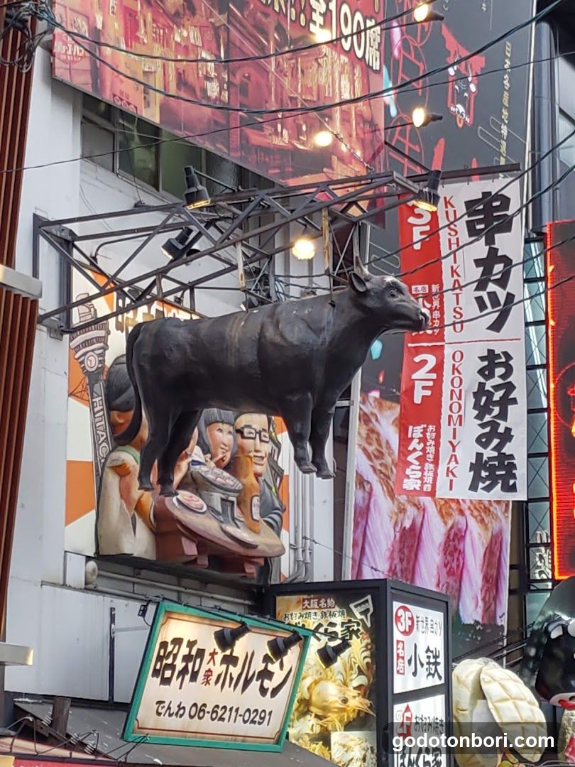 Street Scene with Hanging Sculpture and Signage