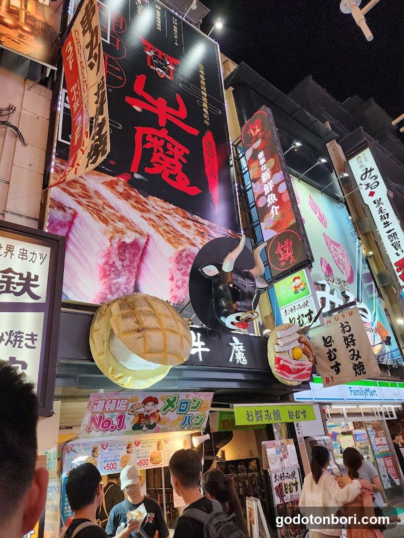 Night Street Scene with Food Stalls and Signage
