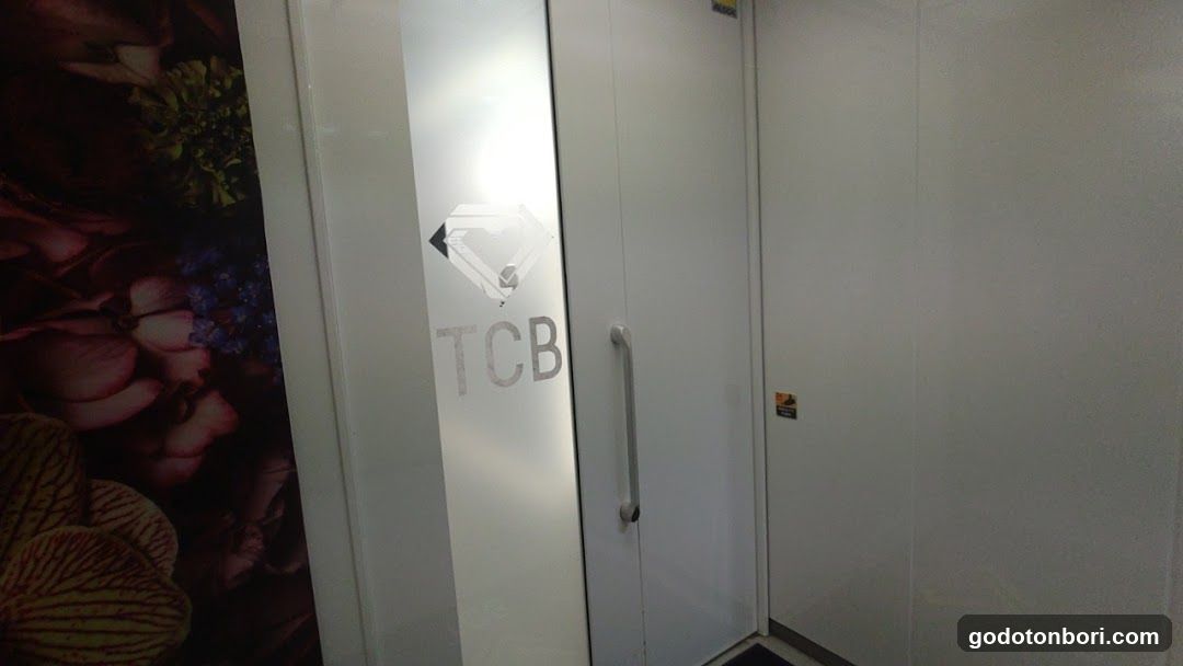 Interior Door with Logo and Floral Wall Art