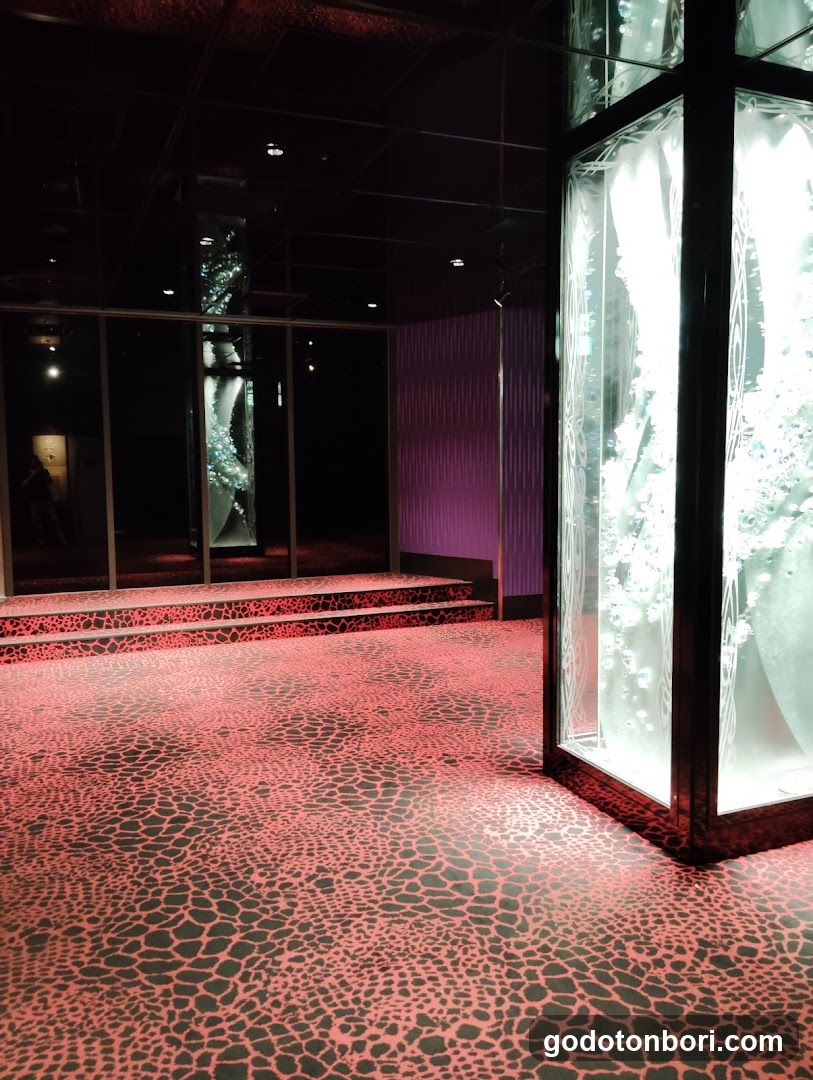 Interior with patterned floor and illuminated display