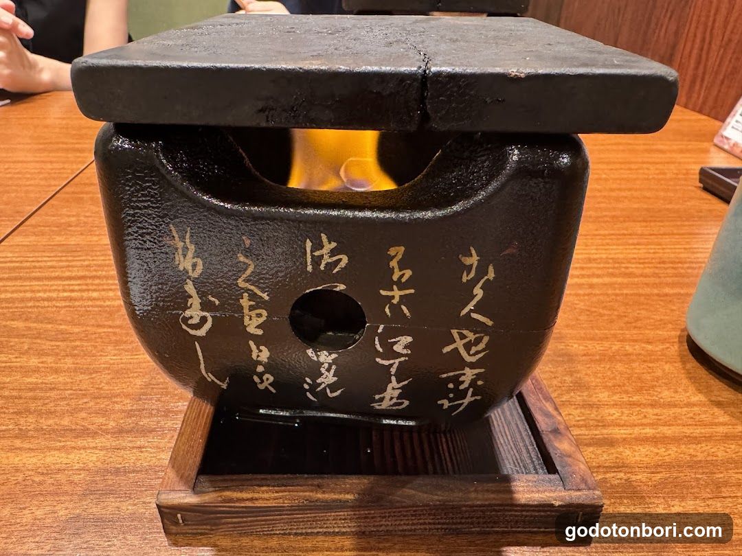 Japanese charcoal brazier with calligraphy