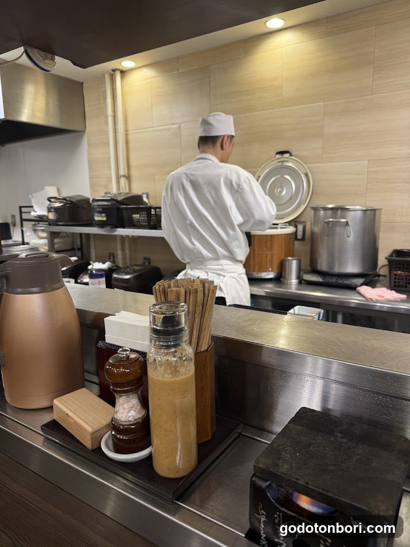 Kitchen Interior with Chef Cooking