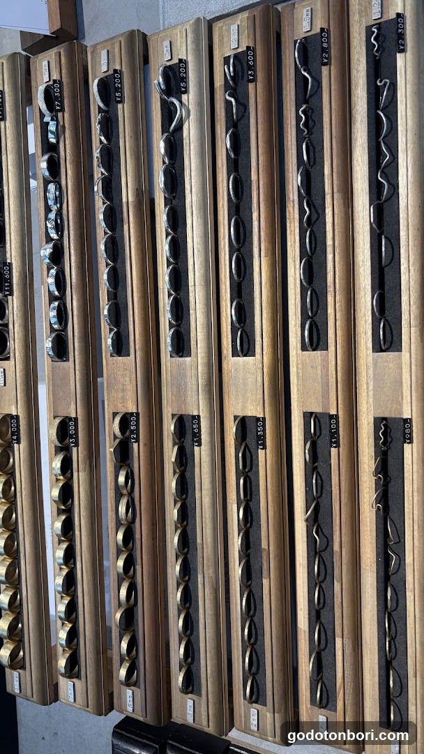 Wooden display racks with metal rings
