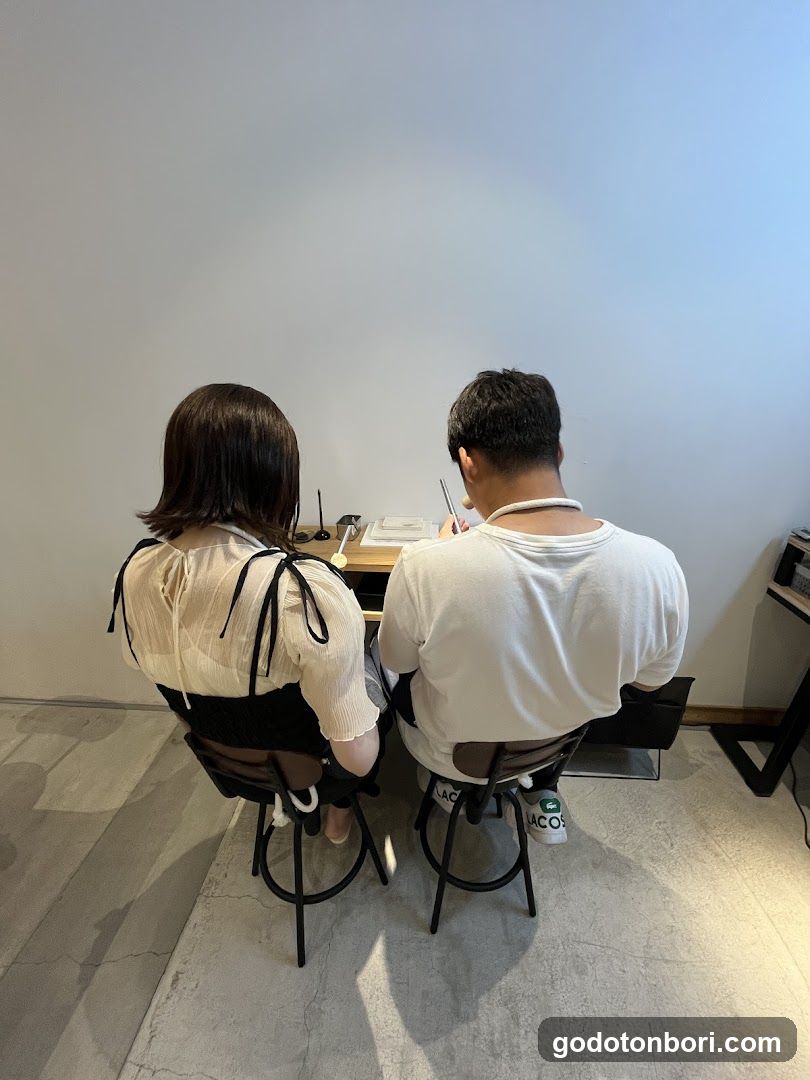 Two people sitting at a desk
