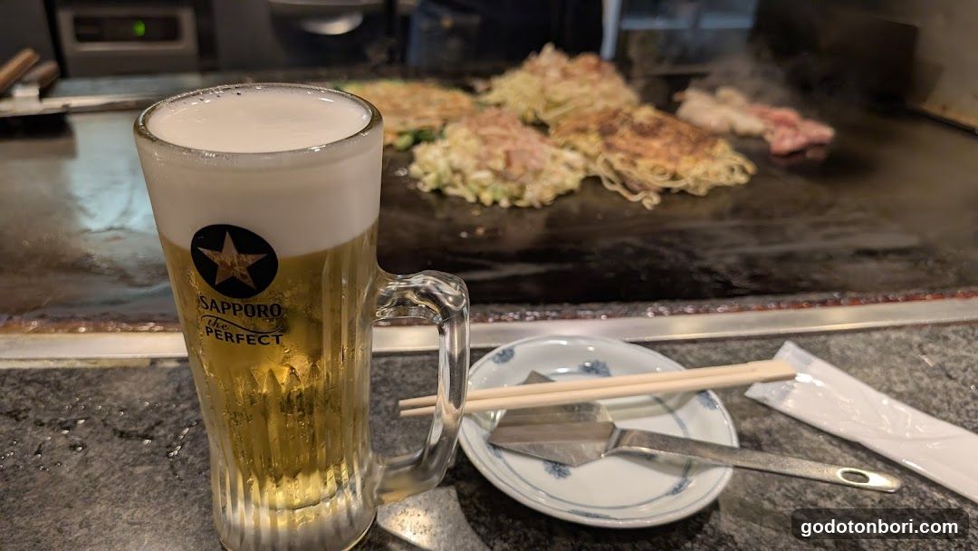 Okonomiyaki and Beer at Teppanyaki Restaurant