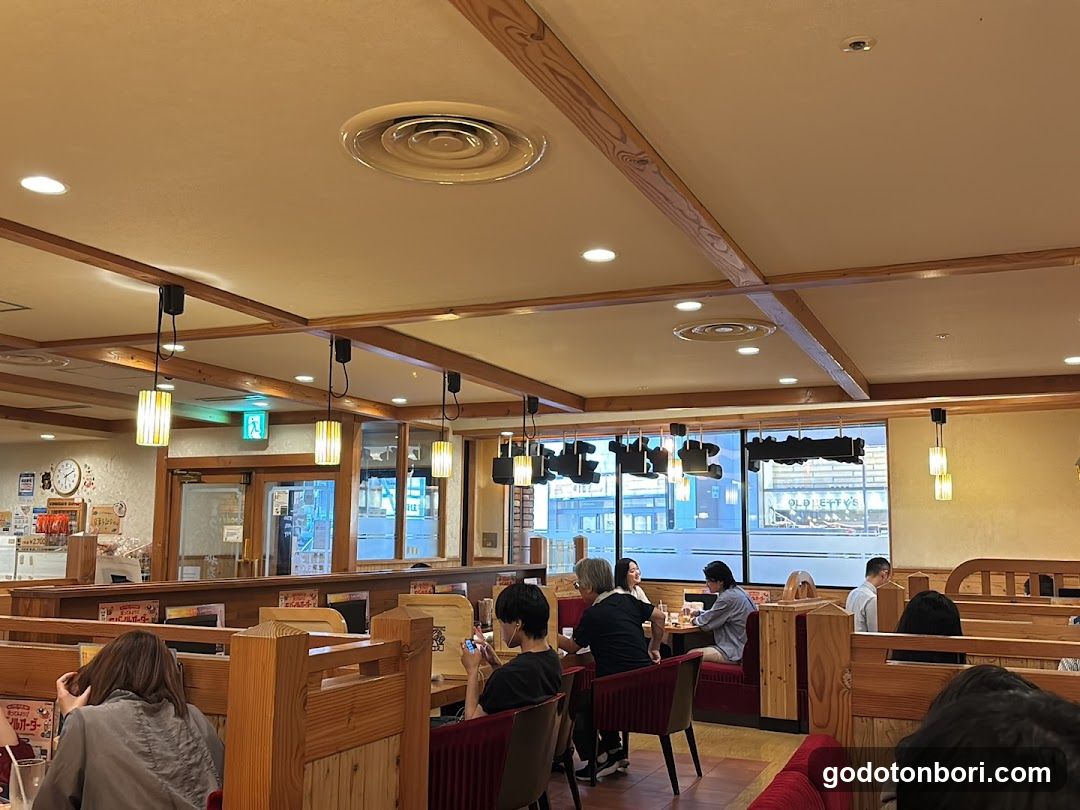 Restaurant Interior with Wooden Booths and Hanging Lights