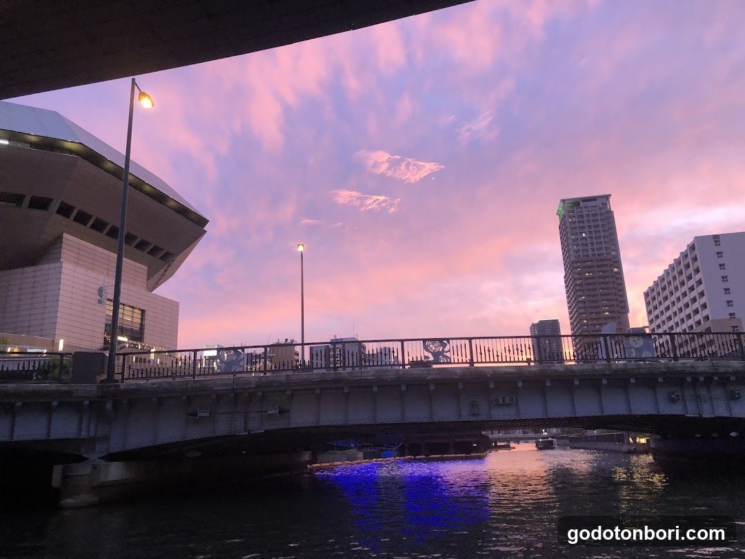 Sunset over bridge and city skyline