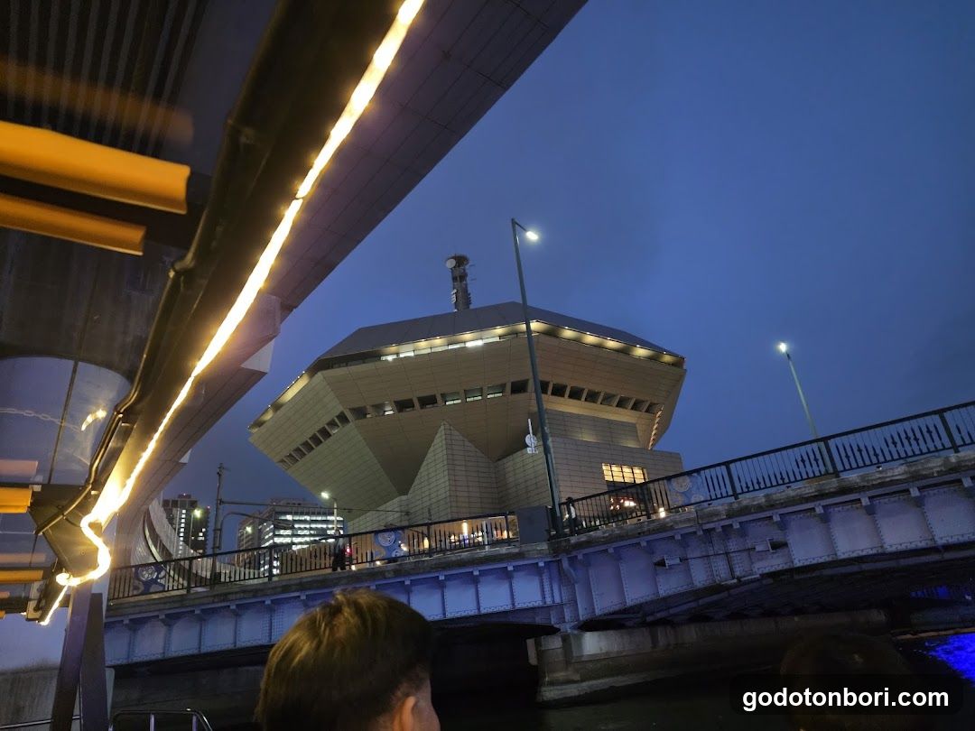 Night view of a modern building under bridge lights