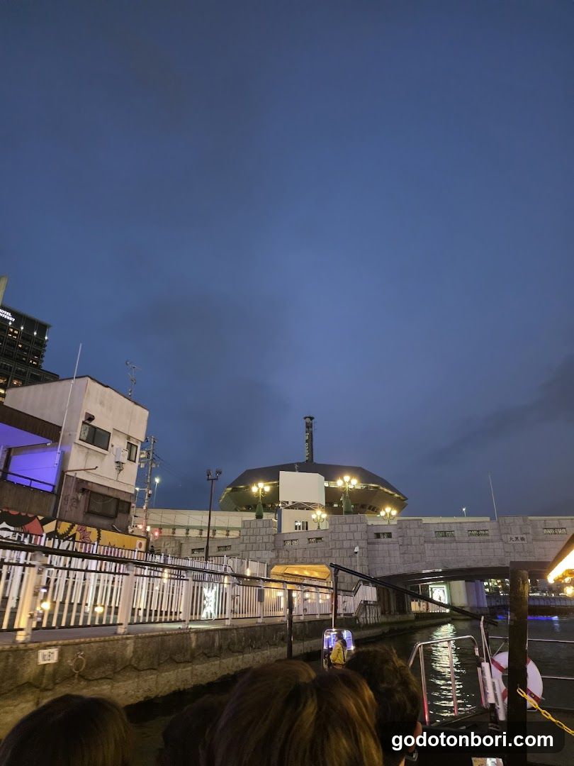 Evening waterfront scene with illuminated building