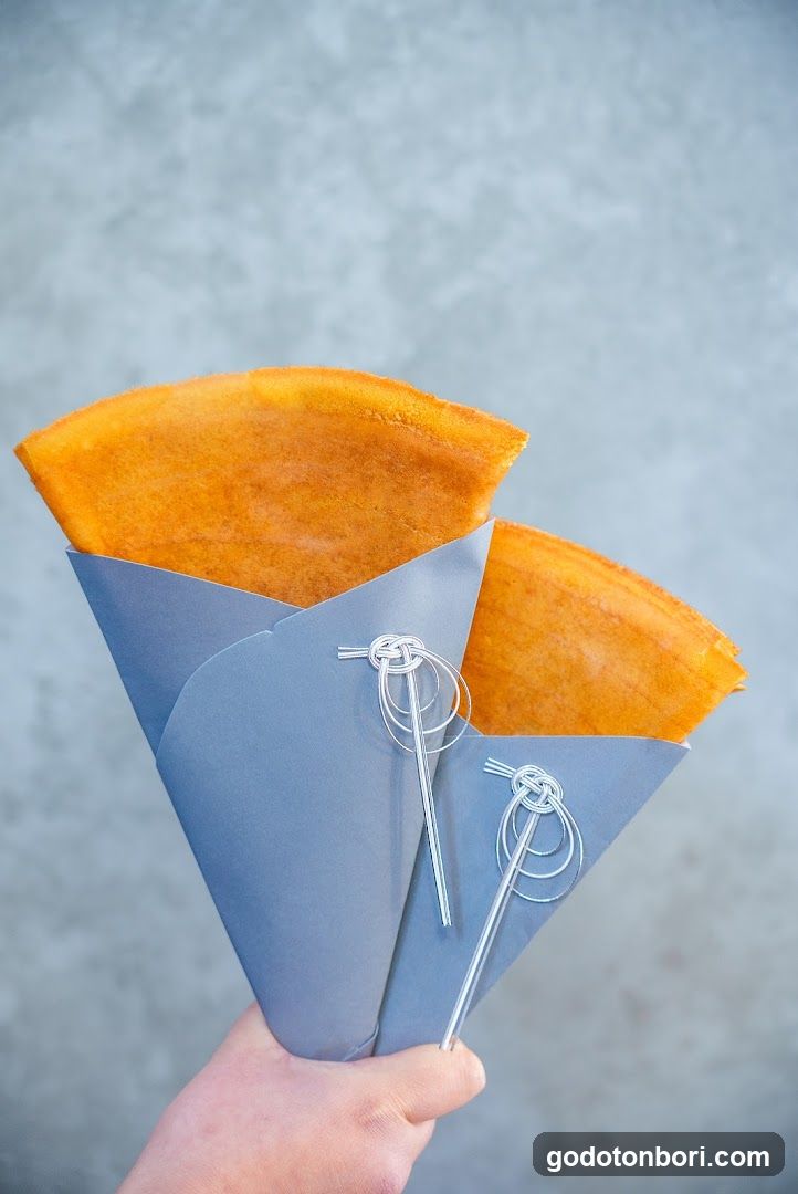 Hand holding crepe cones