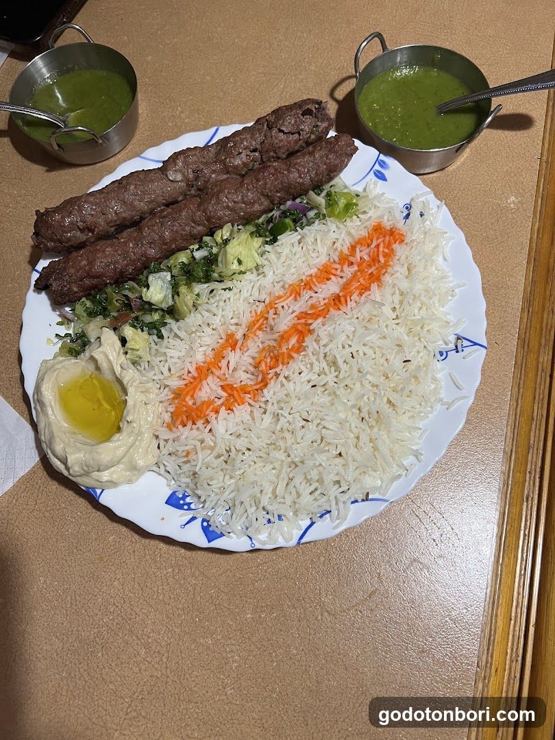 Plate of Kebabs and Rice with Hummus
