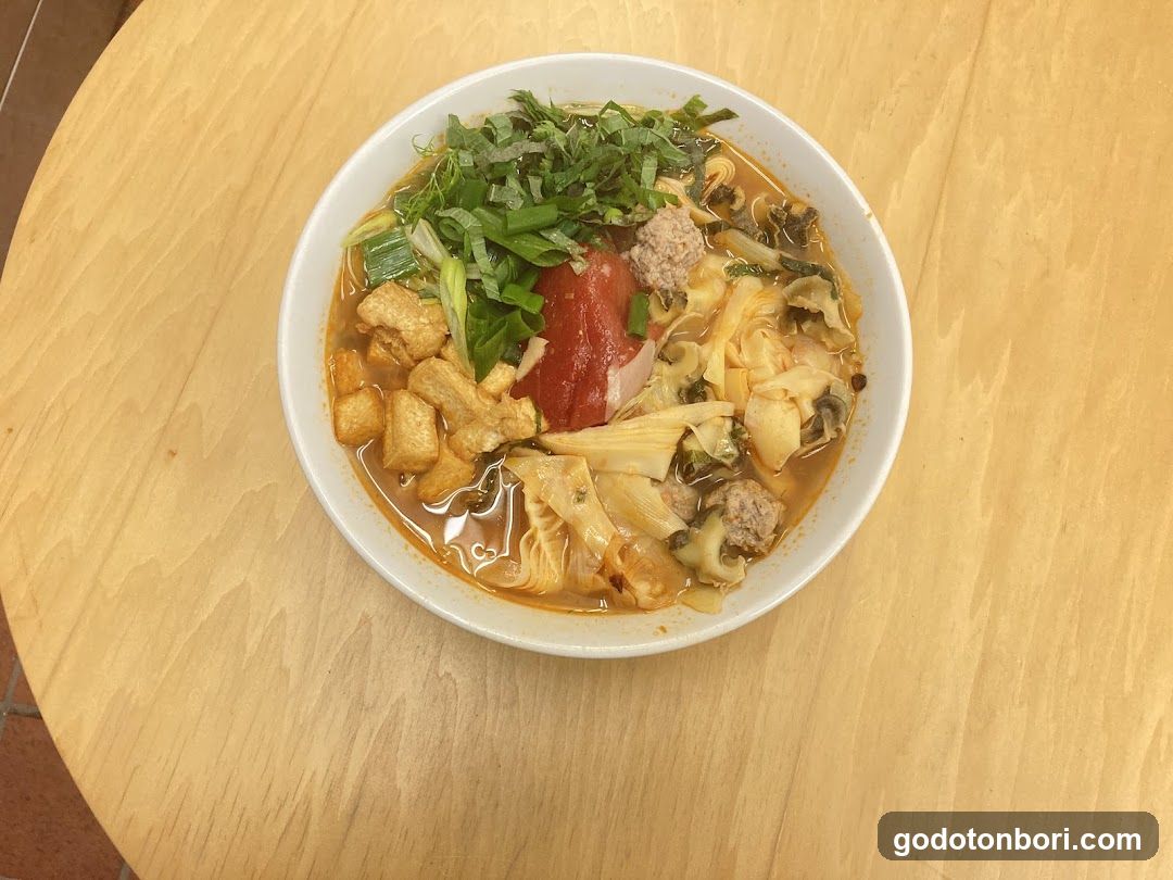 Bowl of Noodle Soup with Tofu and Greens
