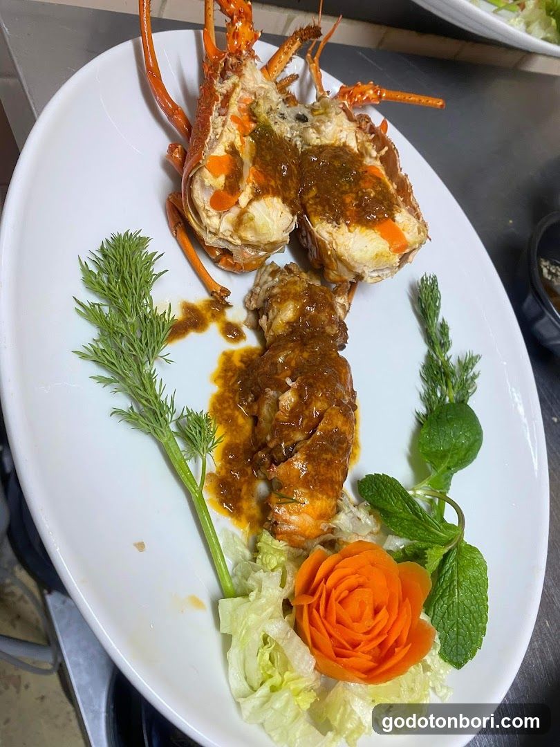 Sauced Lobster with Carrot Rose Garnish