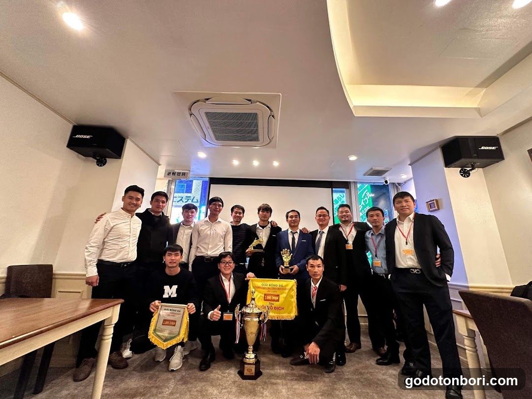 Group photo with trophies and awards