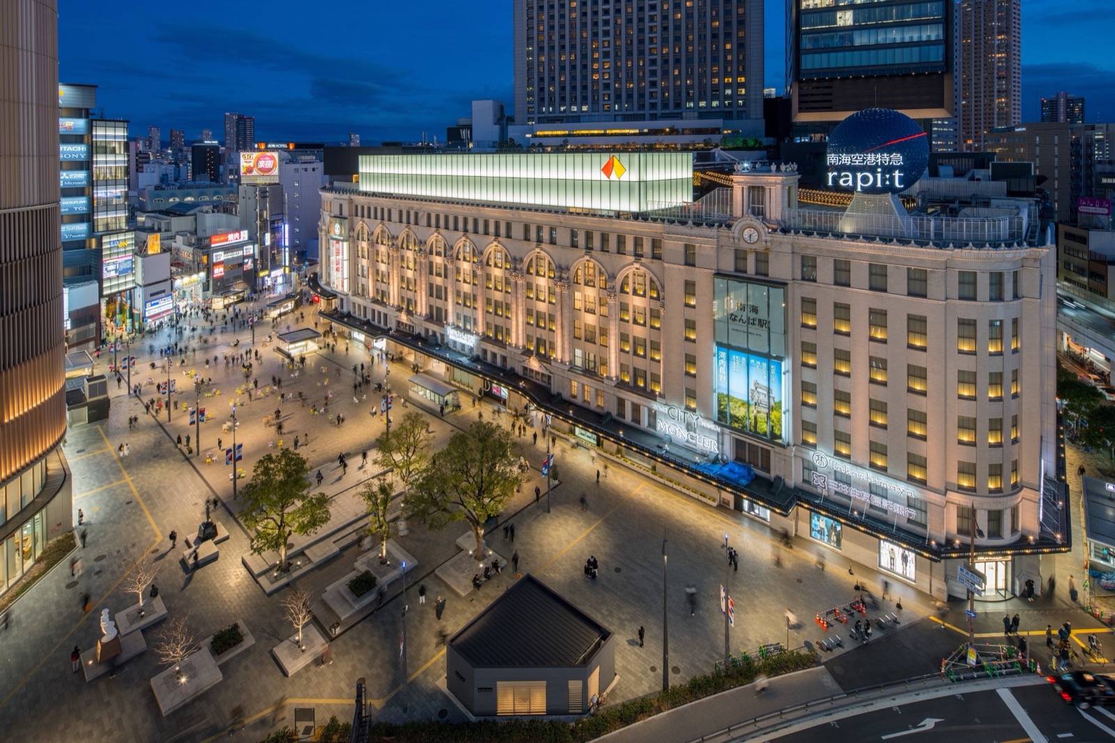 Skip the Shibuya-style crowd. Namba Halloween this year is the square, the stairs, and one wrapped train