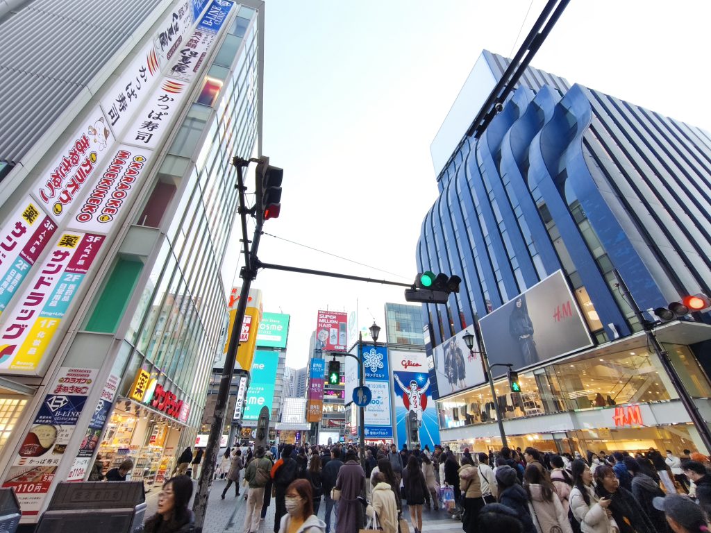View of H&M Ebisubashi store facing the Glico sign in Dotonbori