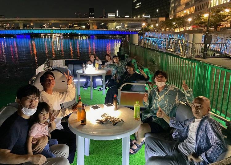 Night view of Osaka skyline from an Illumination Cruise on the Dotonbori river